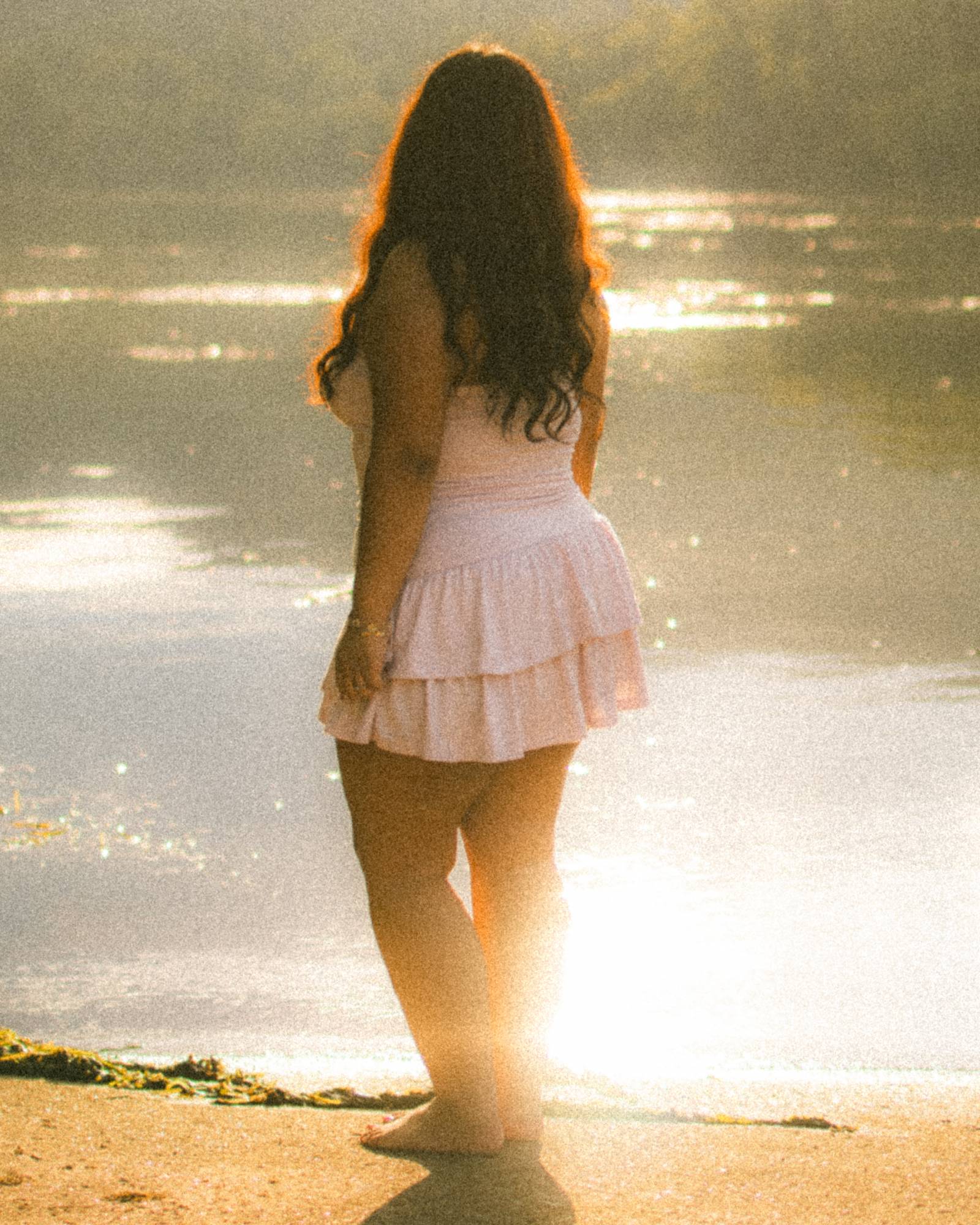 senior portrait at sunset by the water